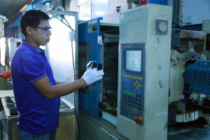 Technician operating an industrial machine