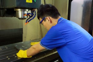 Technician operating a machine tool safely